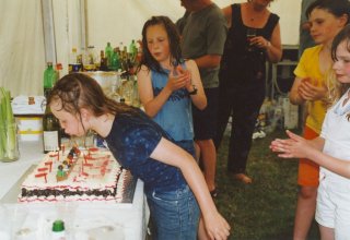 Wet Alice blows out candles on her birthday cake