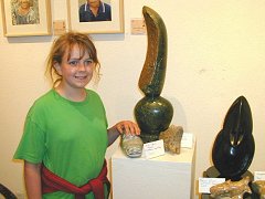 Alice with her baboon head sculpture