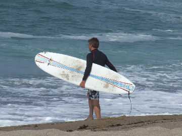 Etienne with Surfboard